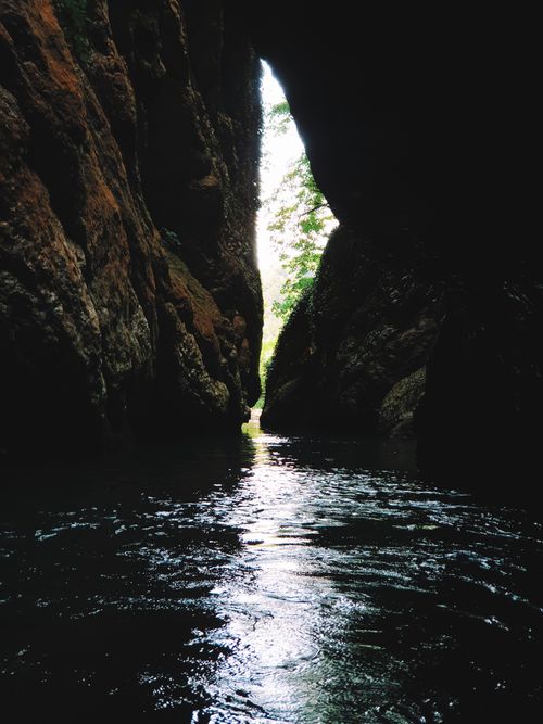 Free Tranquil river flowing through a narrow canyon surrounded by eroded rocks, perfect natural scenery. Stock Photo