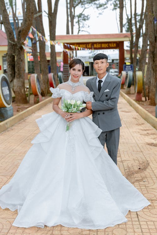 Smiling Newlyweds Posing in Park