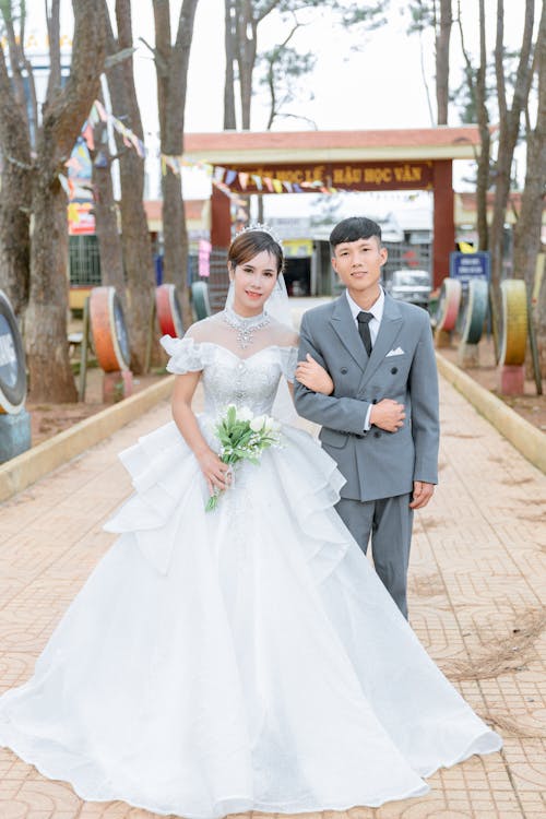 Newlyweds Posing Together in Park