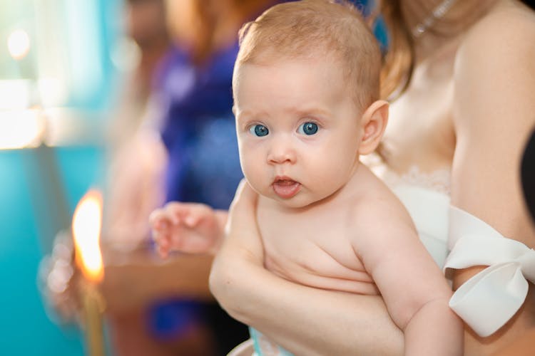 Woman Holding A Little Baby