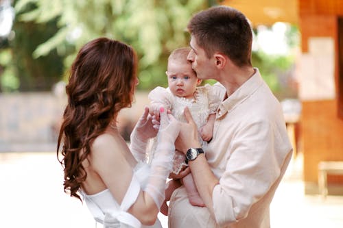 Couple Holding Their Baby