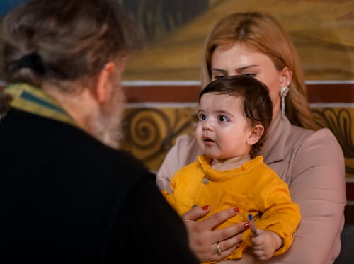 Free Parents with Their Child in a Church Stock Photo