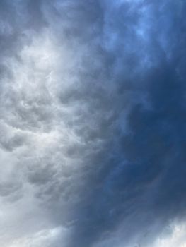 A captivating view of dark storm clouds gathering in the sky, creating a dramatic atmosphere.. captivating, view, dark