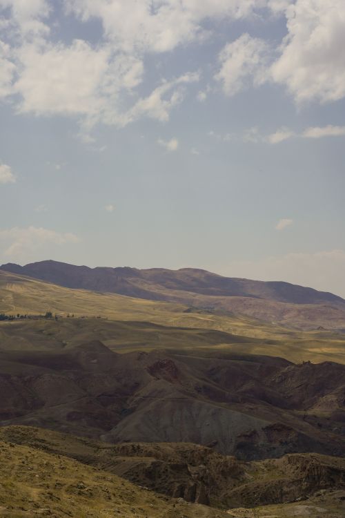 Free A breathtaking view of the rolling hills in Doğubayazıt, Ağrı, Türkiye under a clear sky. Stock Photo