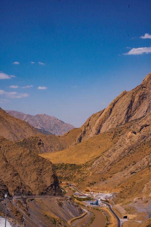 Free Breathtaking view of arid mountains and valley in Hakkari, Türkiye, with clear blue sky. Stock Photo