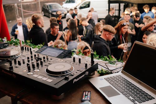 A Laptop and a DJ Console on the Stage 