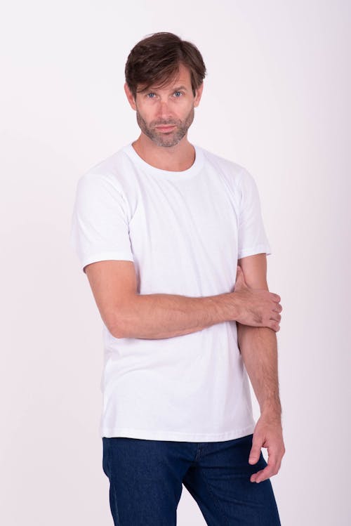 Man in White T-shirt and Jeans