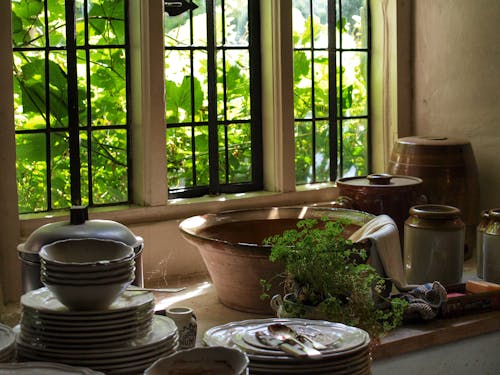 Dishes in a Kitchen by the Window