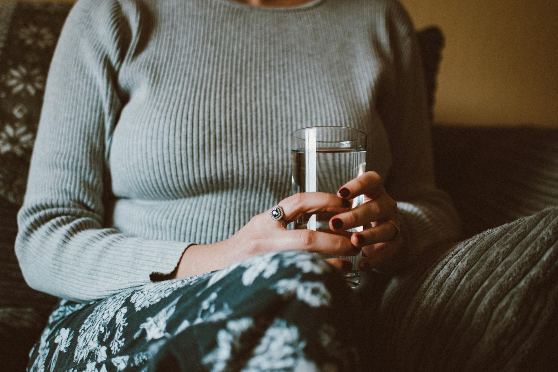 holding a glass of water
