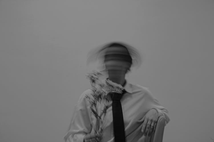 Model With Flowers In Shirt And Necktie With Blurry Head