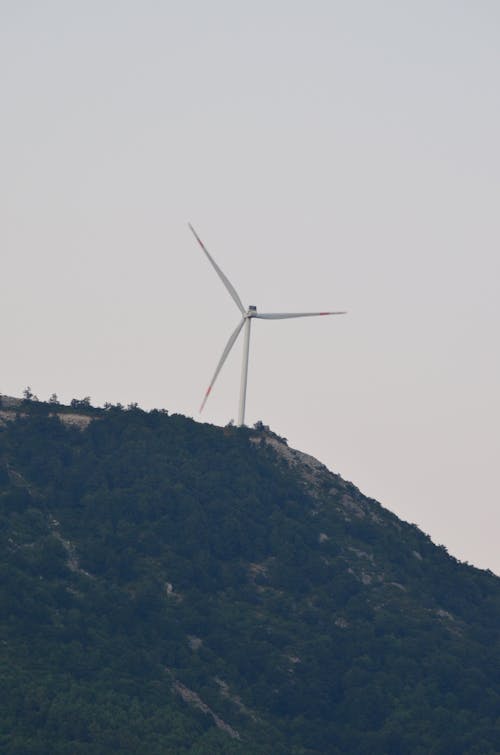 Wind Turbine behind Hill