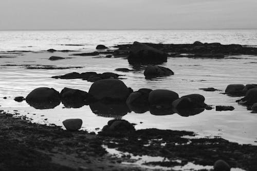 Stones in the Sea Near the Beach