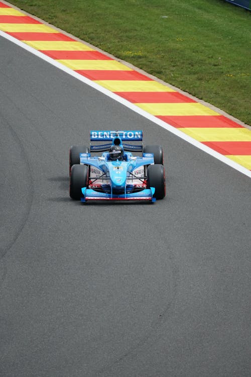 The Benetton B198 1998 Formula 1 Car at a Historic Racing Car Demonstration on a Track 