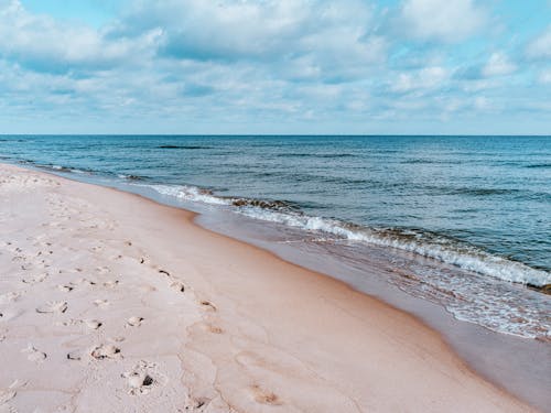 Free Footprints on the Beach Sand Stock Photo