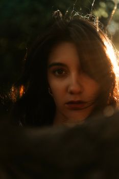 Artistic portrait of a woman with dramatic lighting and warm tones, creating an intense, moody effect.. pexels, artistic, por