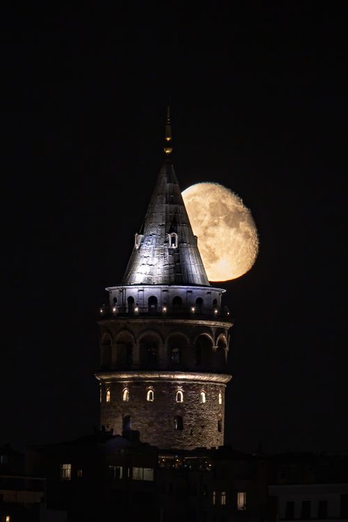 Free Stunning view of Galata Tower with the moon in the background, showcasing Istanbul's historic architecture at night. Stock Photo