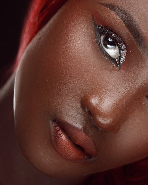 Close-up Studio Shot of a Young Woman in Glamour Makeup 