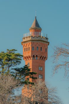 A captivating red brick tower towering against a clear blue sky in Maldonado, Uruguay.