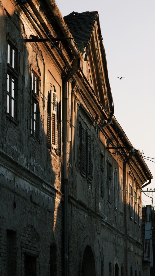 Free Vintage urban architecture with warm evening shadows on building facade Stock Photo