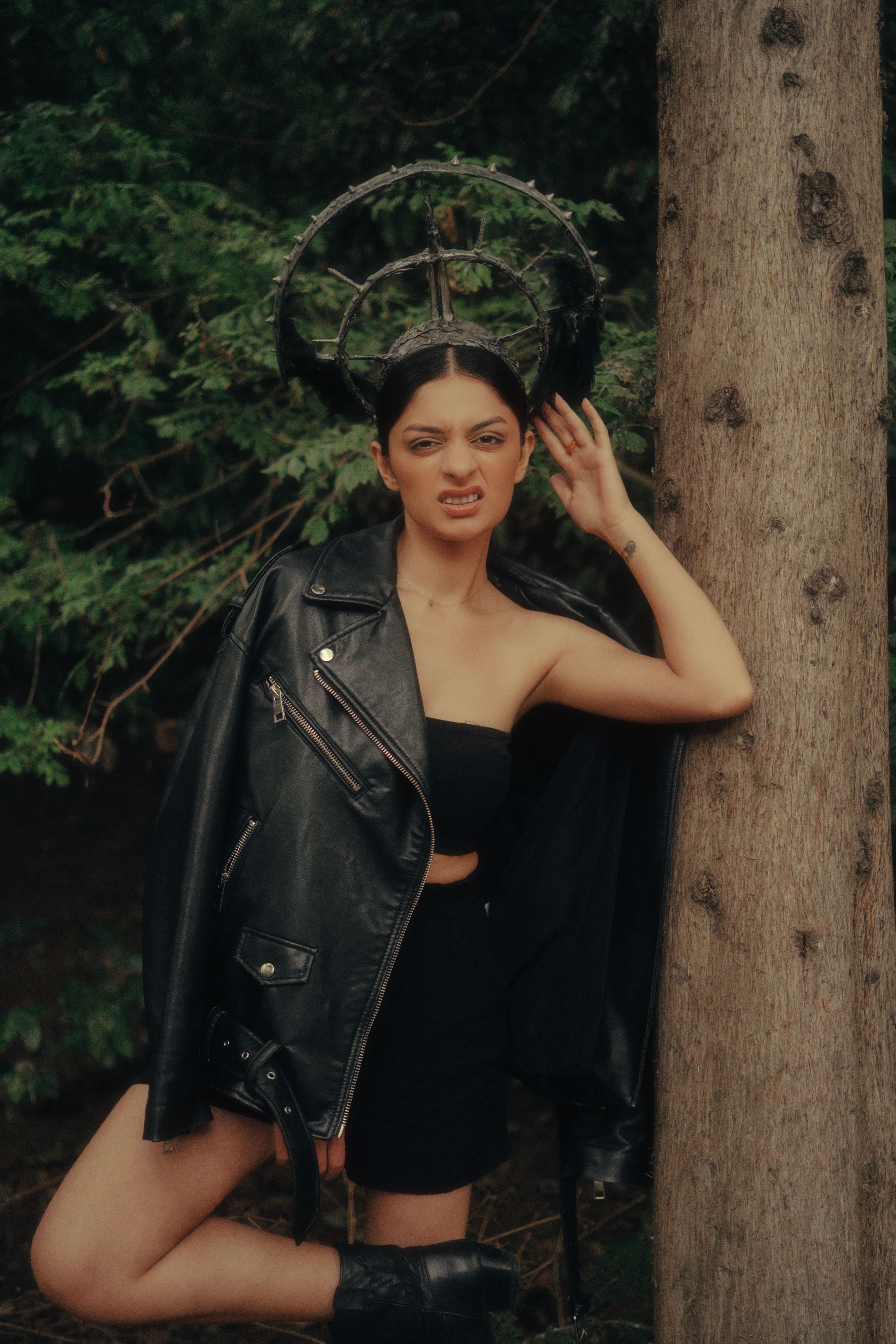 Woman in Leather Jacket Posing by Tree · Free Stock Photo