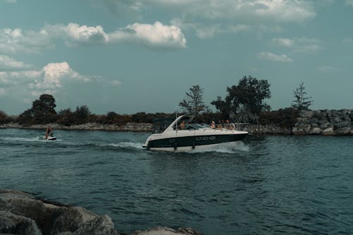 A boat is traveling on the water near a body of water