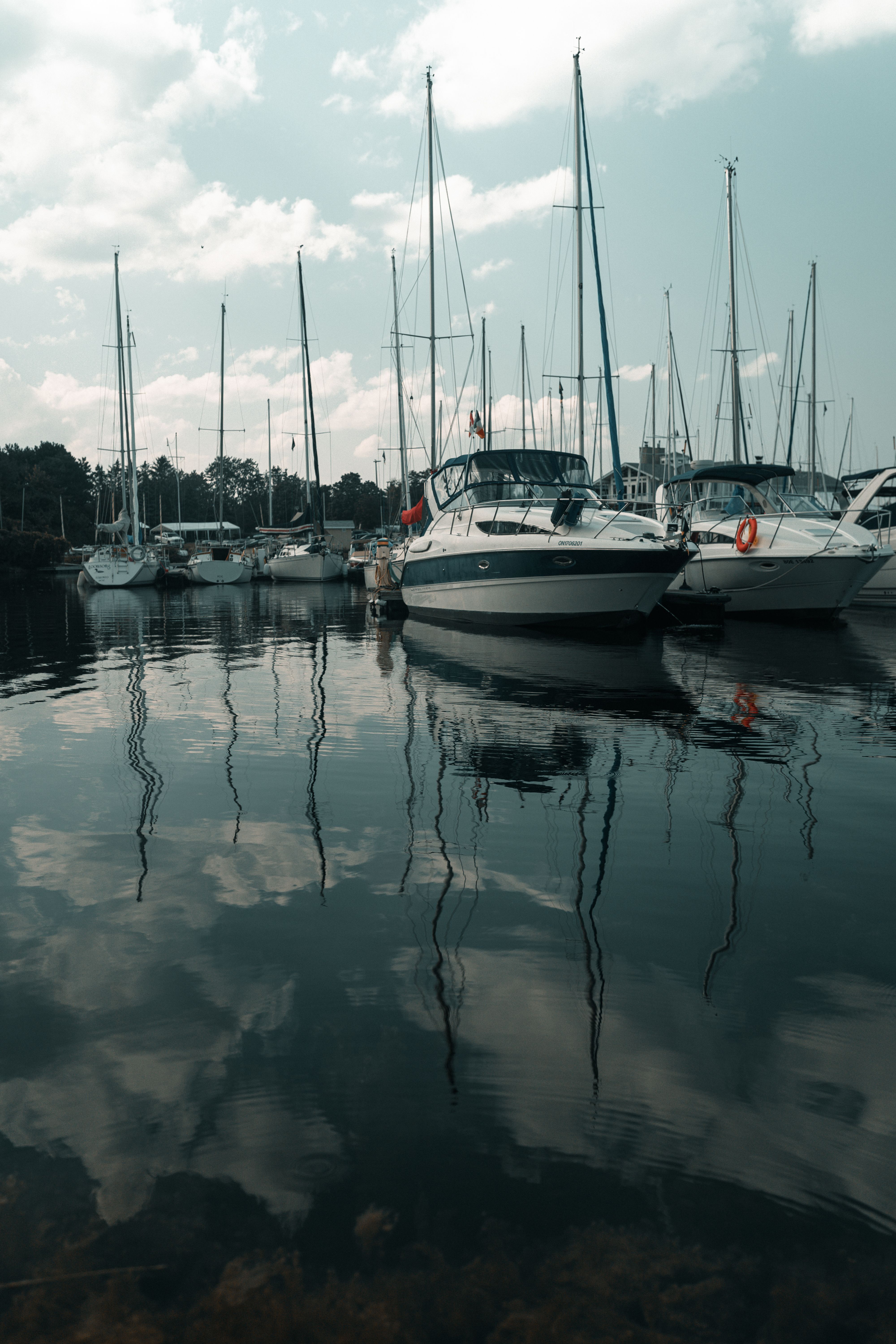 A marina with boats docked in the water · Free Stock Photo