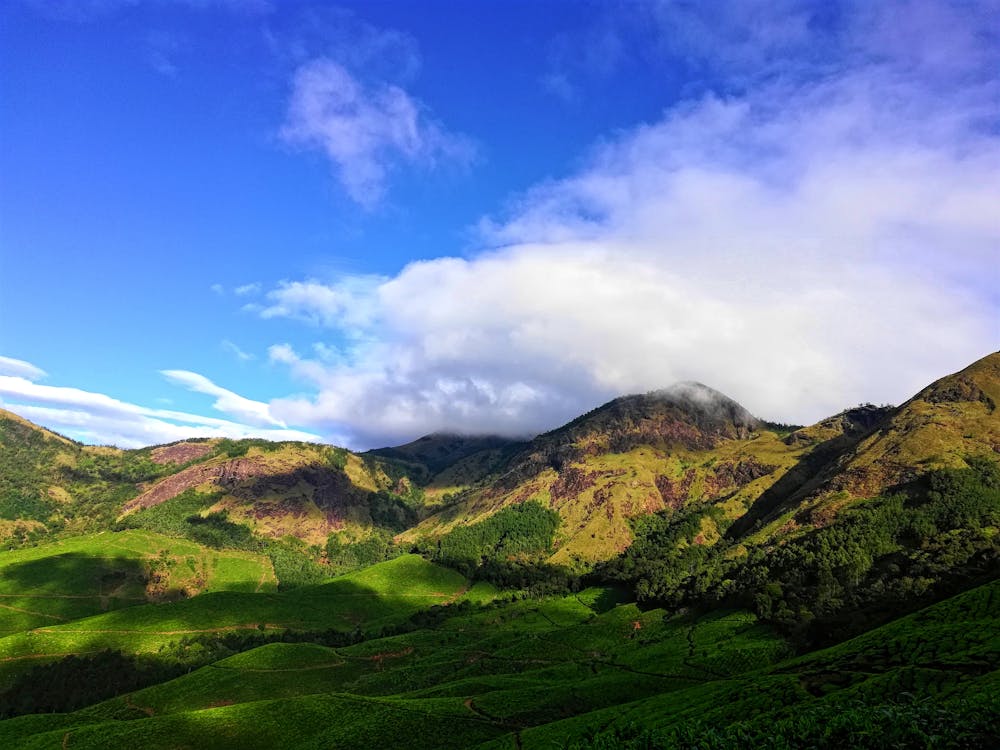 Green Mountain Under Cloudy Sky