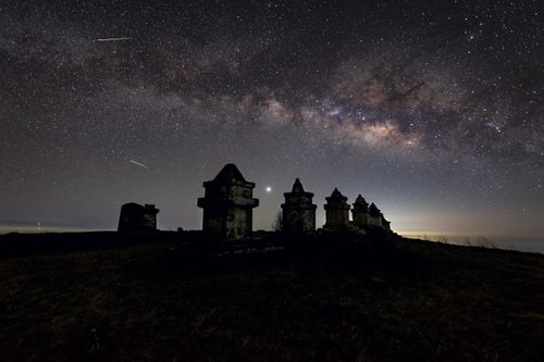 Free Stunning night sky view of the Milky Way over ancient structures in Koshi Province, Nepal. Stock Photo