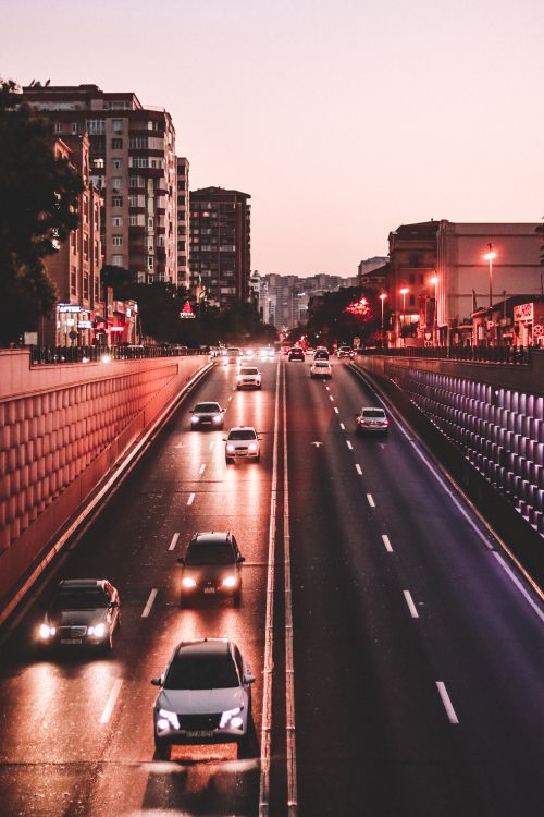 Free View of night traffic on the urban streets of Baku, Azerbaijan, showcasing city lights and architecture. Stock Photo
