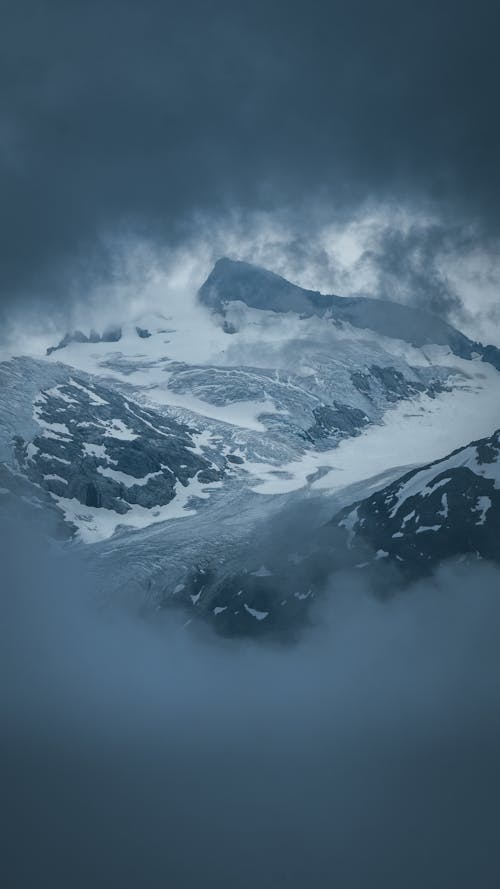 Rain Cloud over Mountains in Snow