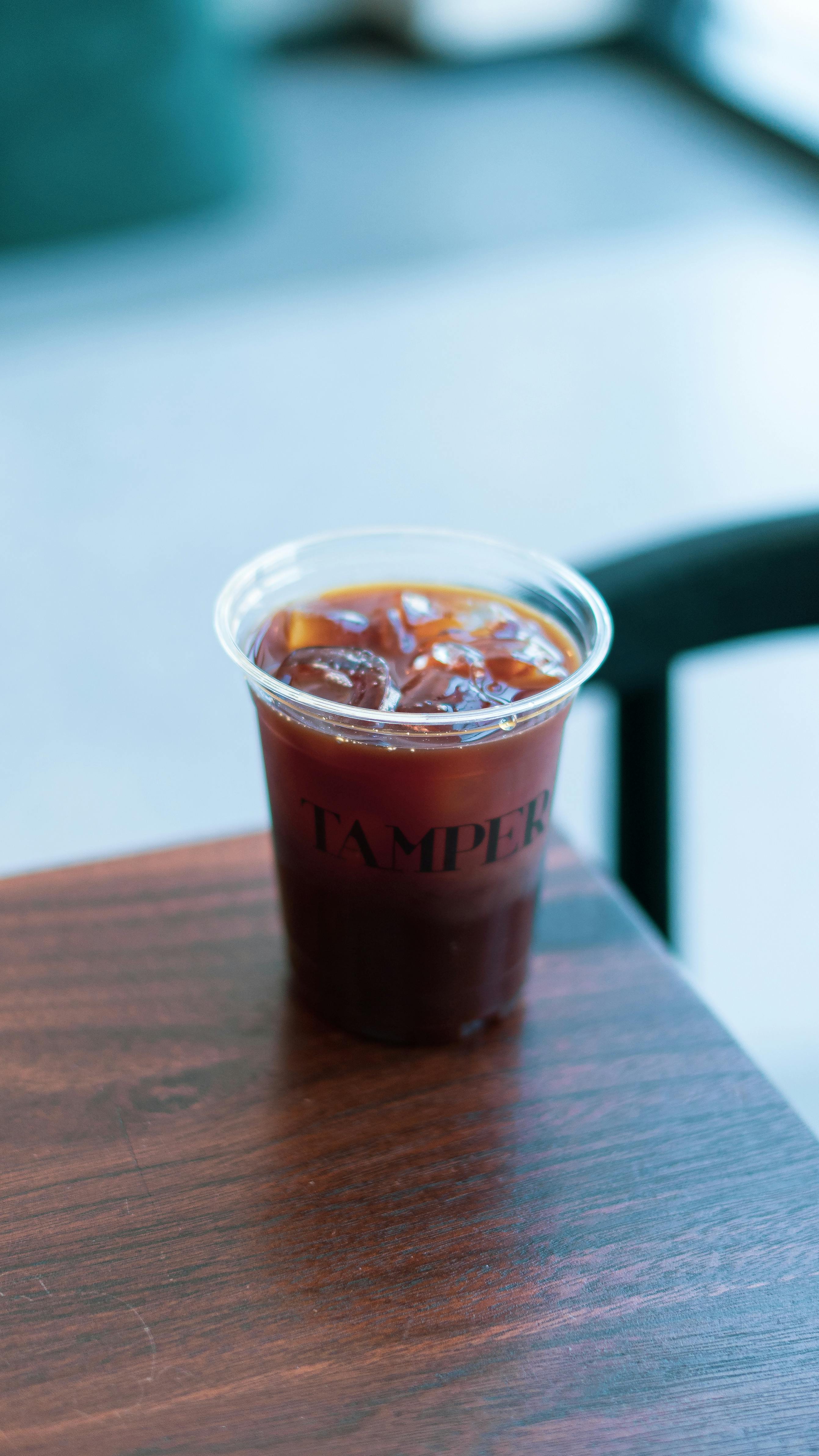 orange-cold-drink-in-disposable-cup-free-stock-photo