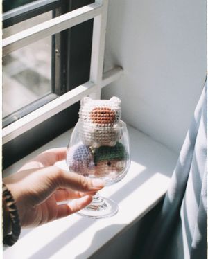 Crocheted animal toys on a sunlit windowsill — photo by stayhereforu on Pexels