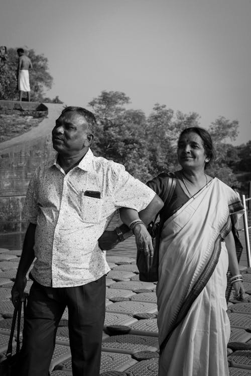 Man and Woman Walking Together in Black and White