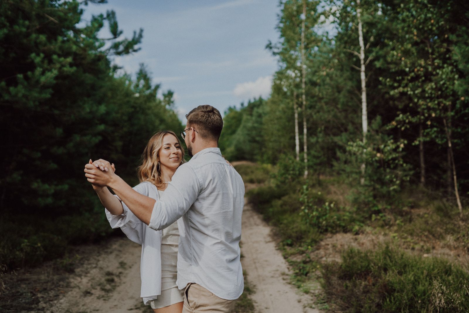 Couple dancing bachata with the signature hip pop and close footwork
