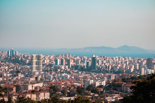 Stunning panoramic view of Istanbul's urban skyline with towering skyscrapers and the Bosphorus Strait.