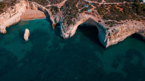 Free Bird's-eye view of the stunning cliffs and beach at Praia do Carvalho, Algarve, Portugal. Stock Photo