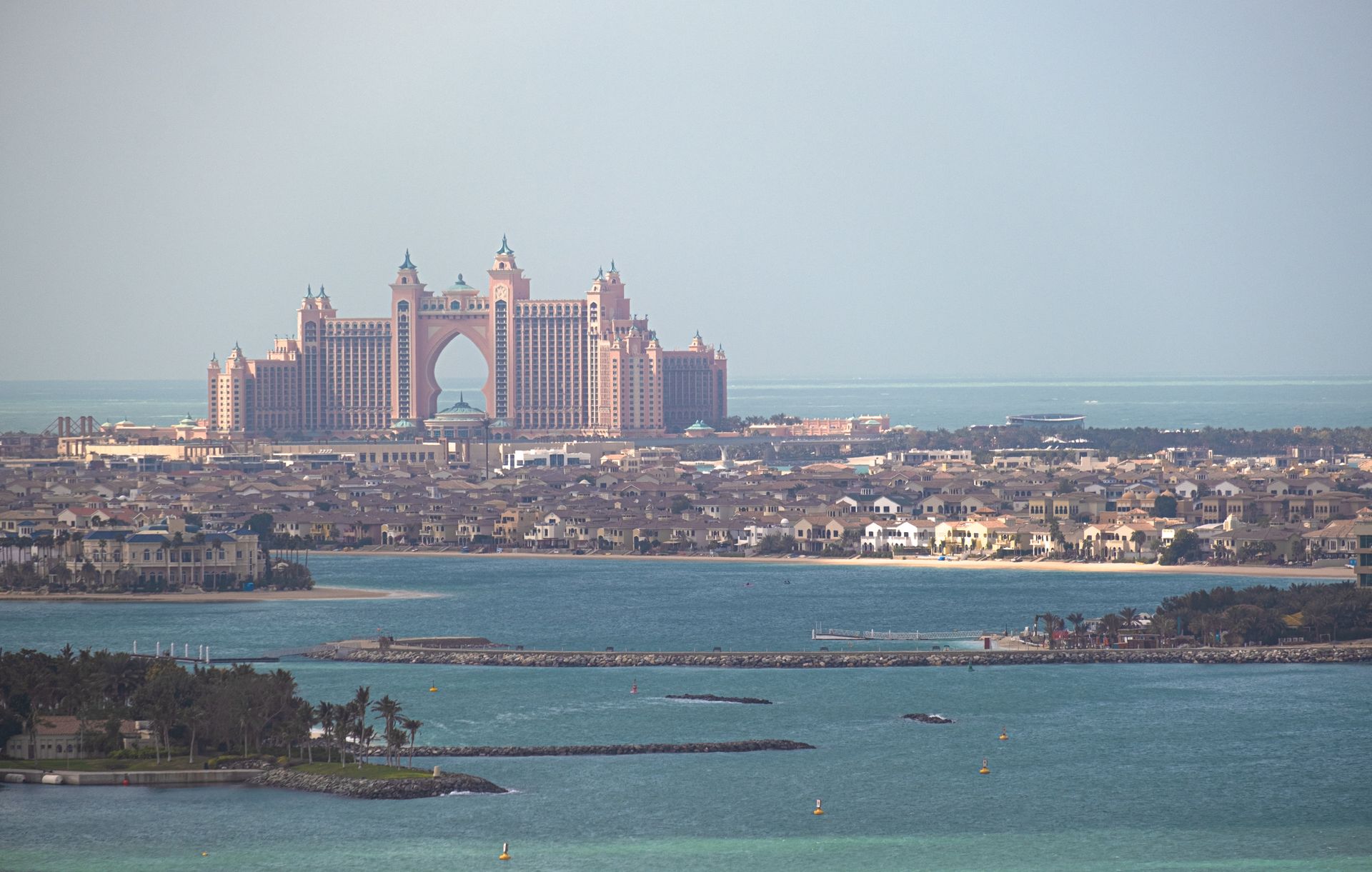 A stunning aerial view of Atlantis The Palm resort in Dubai, with the city skyline.