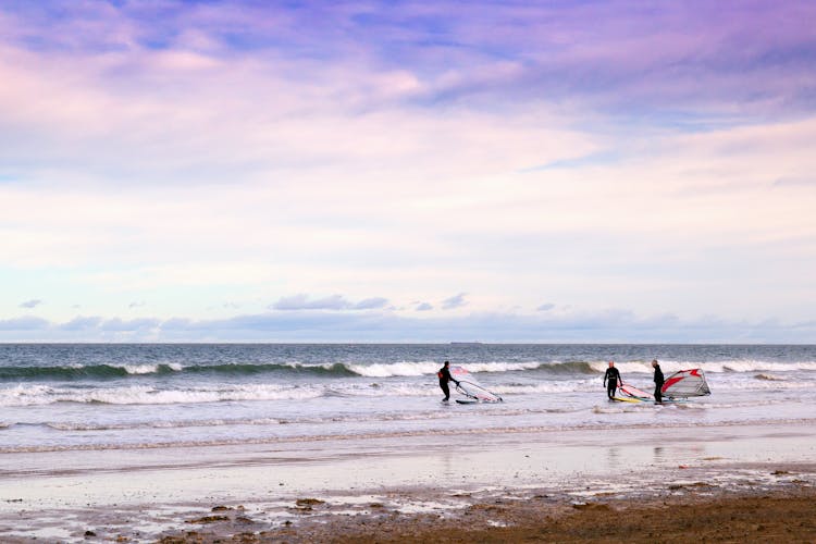 Windsurfers In Sea