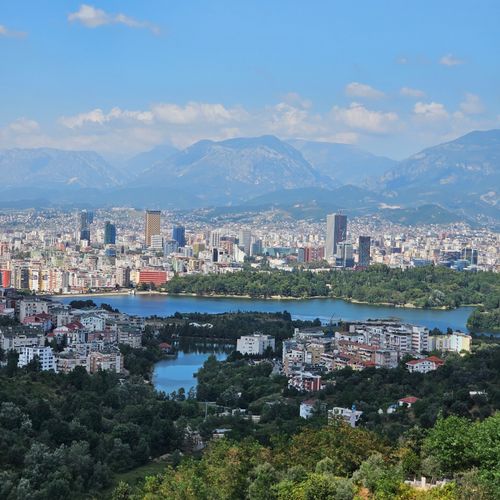 Free A picturesque aerial view of Tirana, Albania with mountains and urban landscape. Stock Photo