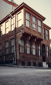 A vintage wooden house on a quiet street in Istanbul, showcasing Ottoman architecture.