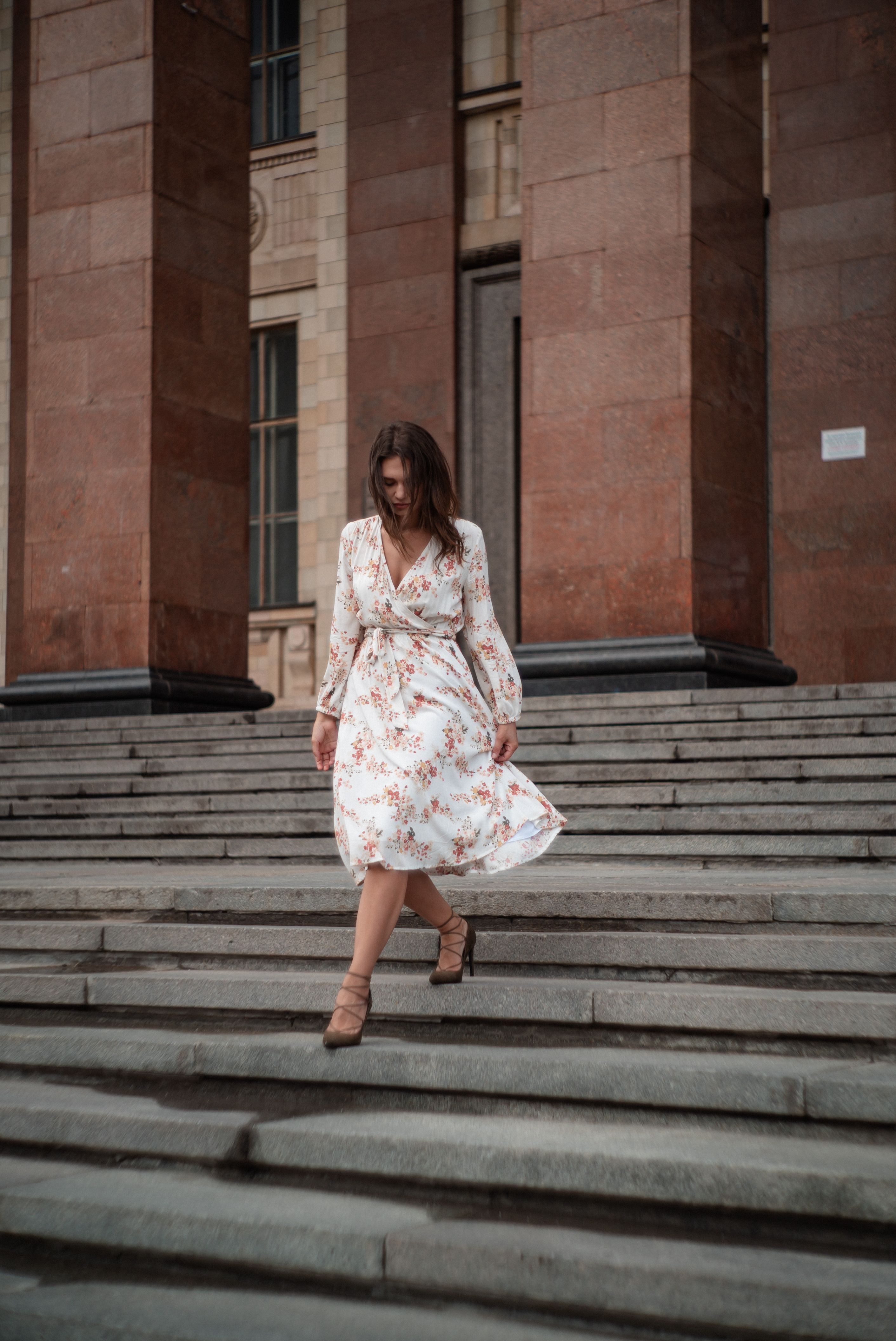 Woman in Floral Dress Walking Down Steps · Free Stock Photo