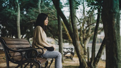 Woman Sitting On Bench