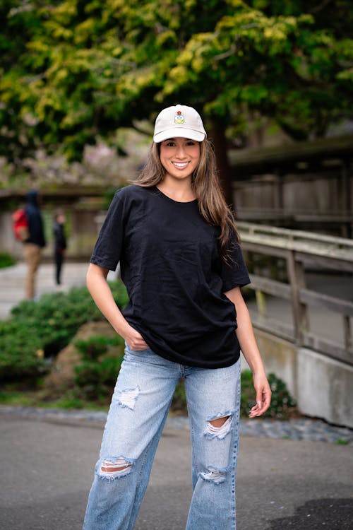Smiling Woman in Cap and T-shirt