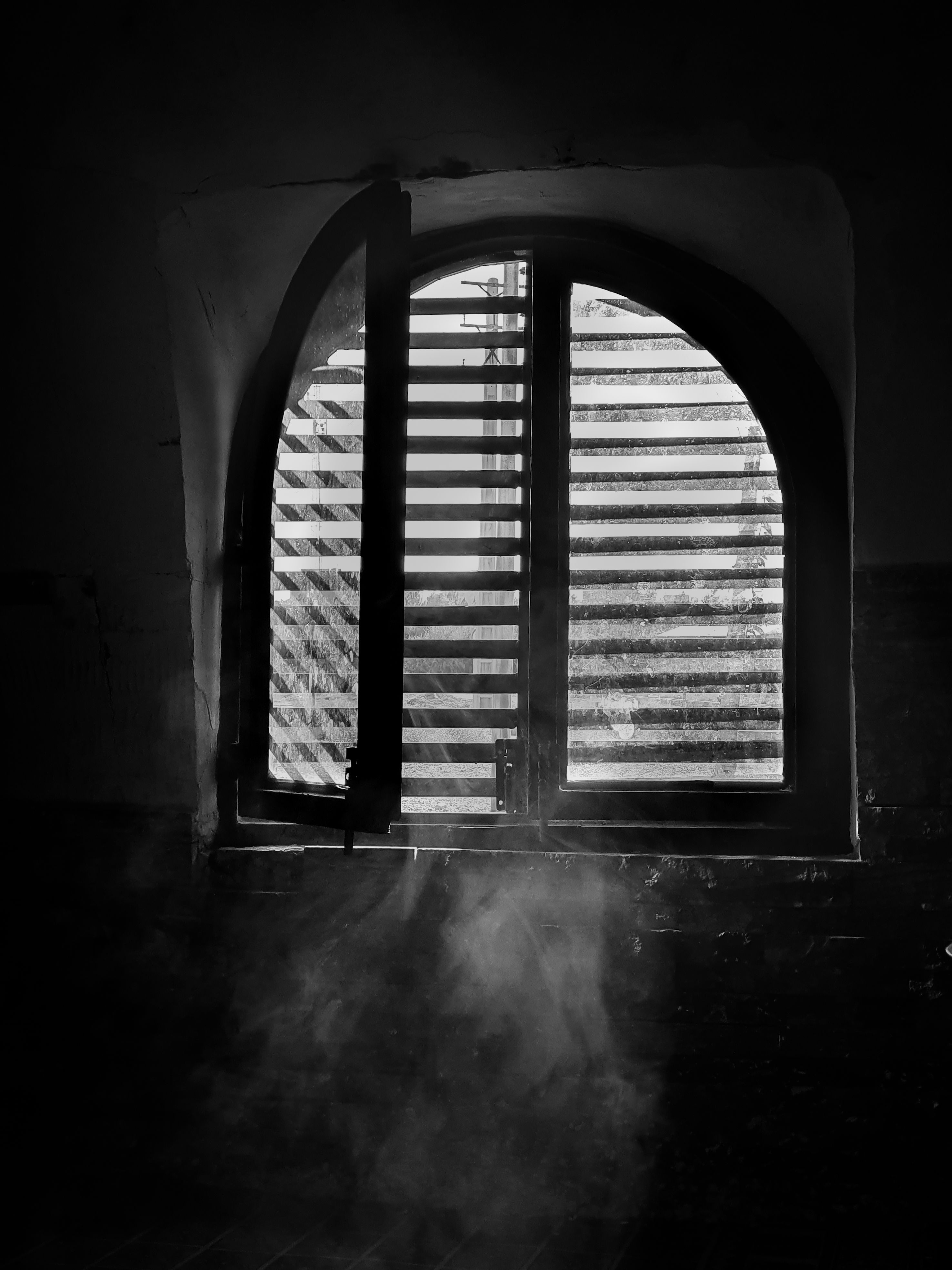 Dramatic arched window with light beams and dust motes, creating a moody atmosphere.. pexels, dramatic, arched