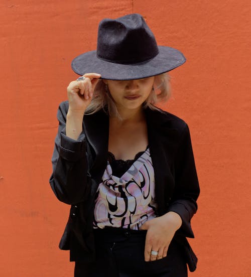 Portrait of Woman in Black Clothes and Hat