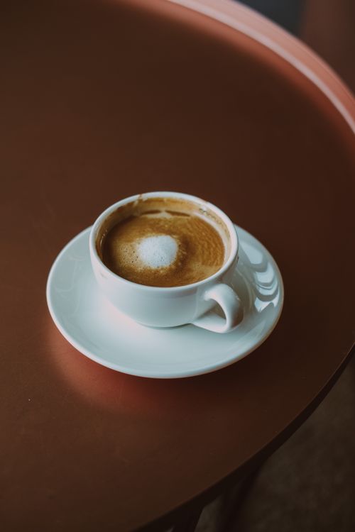 Free A cappuccino served in a white cup on a stylish table in Ankara, Türkiye. Stock Photo