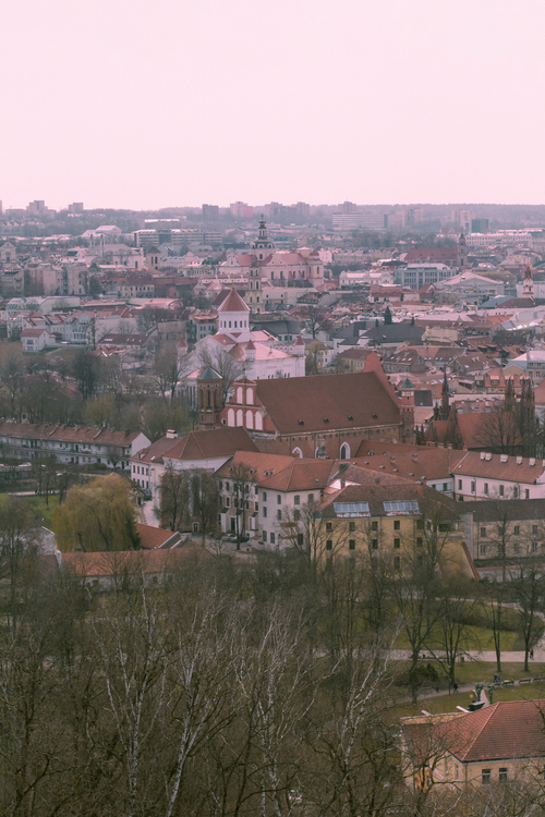 Free Explore the charming cityscape of Vilnius with its historic architecture and vibrant urban life. Stock Photo