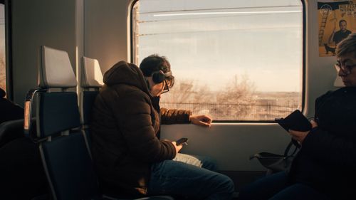 Free Passengers in a train enjoying a scenic view of Madrid, Spain. Stock Photo