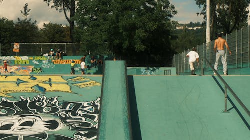 People Skateboarding in Skatepark