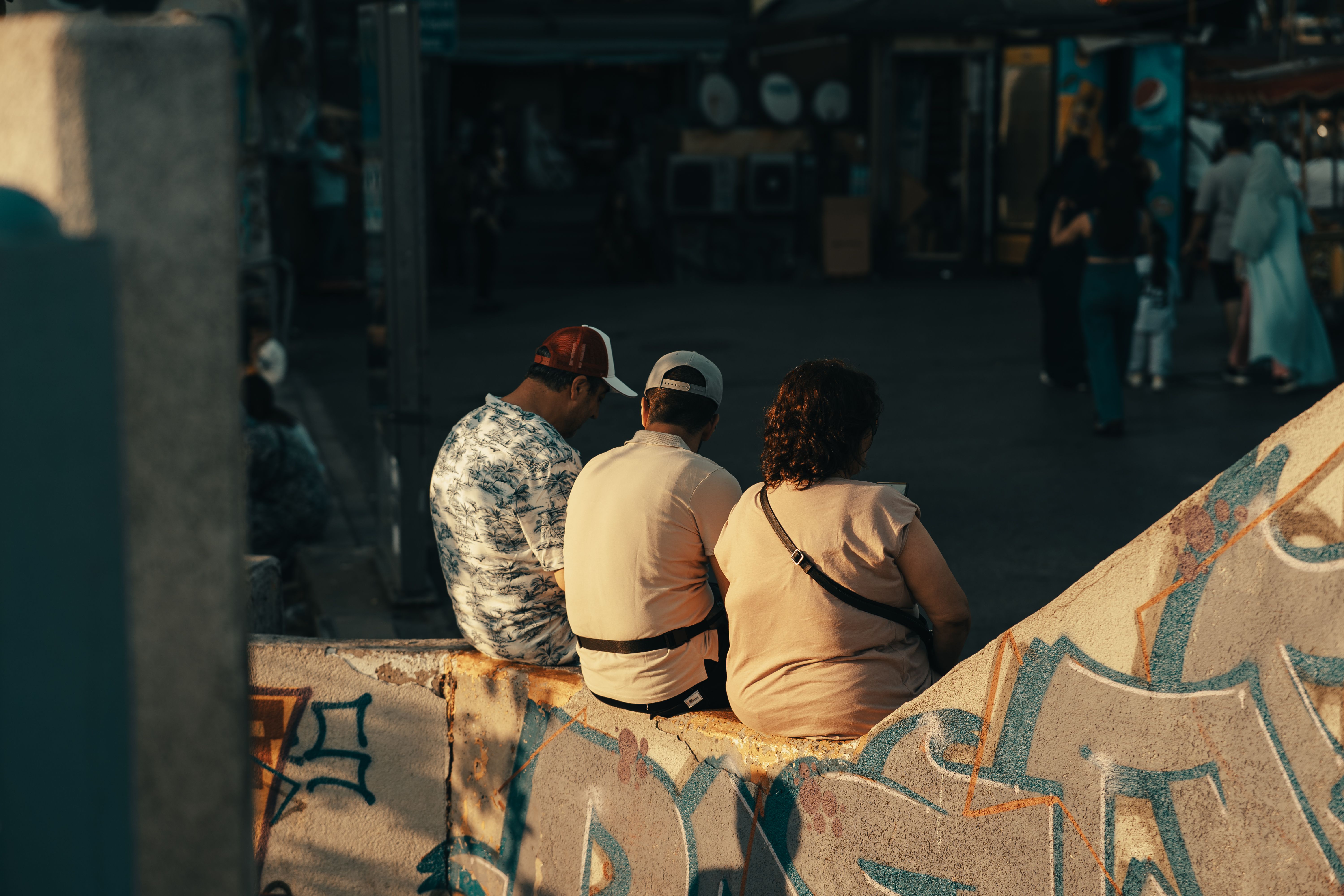 People Sitting on Concrete Railing of Urban Steps · Free Stock Photo